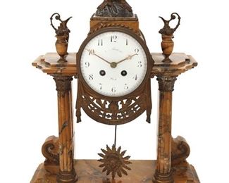 1063
A French Empire-Style Marble Mantle Clock
Late 19th/Early 20th Century
Dial faintly marked: [illegible] / Liege; Movement stamped: VCMB / 449
With black Arabic numeral hour markers, outer minute track, and two train movement, set in an architectural yellow marble case with gilt-bronze mounts
19.5" H x 14" W x
Estimate: $1,000 - $2,000