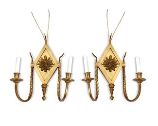 1067
A Pair Of Gilt-Bronze Figural Sconces
First-Quarter 20th Century
Each with a diamond-shaped backplate centering a figural mask and issuing two arms, electrified, 2 pieces
Each: 21.75" H x 13.75" W x 6.75" D
Estimate: $400 - $600