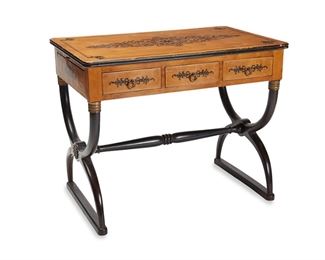 1073
A Charles X-Style Parquetry Desk
First-Quarter 20th Century
The desk with three frieze drawers and two pull-out side surfaces, designed with scrolled foliate marquetry and raised on curule legs
29.75" H x 37" W x 23" D
Estimate: $500 - $700