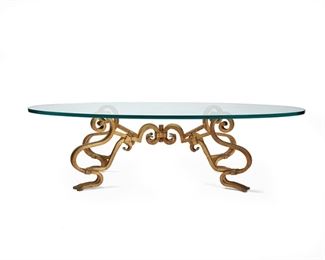 1090
A Gilt-Iron And Glass Coffee Table
20th Century
With oval glass top supported on a scrolled, X-form gilt-iron frame
15.75" H x 60" W x 39.5" D
Estimate: $300 - $500
