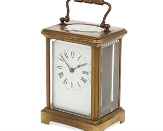 1092
A French Carriage Table Clock
Late 19th/Early 20th Century
Case with a Black, Starr & Frost, New York retail label
The clock with black Roman numeral hour markers and outer minute track in glazed brass case, together with the original velvet-lined, leather-wrapped wood case
Clock (handle up): 5.75" H x 3.25" W x 2.5" D; Case: 5.75" H x 4" W x 4" D
Estimate: $400 - $600