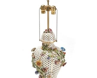 1095
A German Porcelain Table Lamp Base
Late 19th/Early 20th Century
The two-light, white glazed porcelain lamp with a reticulated urn-form body with gilt highlights and polychrome applied flowers, electrified
33" H x 11" Dia.
Estimate: $300 - $500