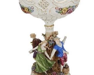 1096
A Von Schierholz Porcelain Figural Centerpiece
20th Century; Plaue, Germany
Marked: Von Schierholz / Handmalerei
The polychrome porcelain centerpiece with a reticulated bowl raised on a tree-form base with four dancing figures
20.25" H x 12.75" Dia.
Estimate: $400 - $600