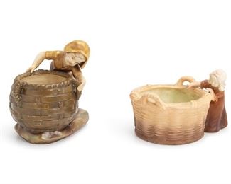 1104
Two Bohemian Porcelain Pieces
Late 19th/Early 20th Century
One marked for Amphora; One marked: Royal Dux / Bohemia
Each with a child peering into a basket, 2 pieces
Larger: 7.5" H x 7.25" W x 5" D
Estimate: $100 - $200