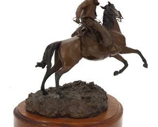 1113
James P. Regimbal
b. 1949, American
"Spooked," 1981
Patinated bronze on wood base
Edition 16/50; signed and dated in the cast: Jim Regimbal © / 1981 / cottonwood; titled to sculpture, titled again to plaque
10.5" H x 11.5" W x 9.5" D
Estimate: $500 - $700