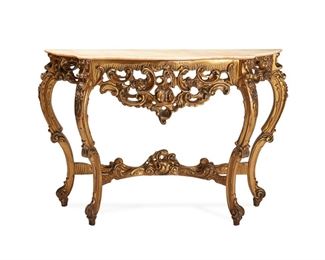 1119
An Italian Carved Giltwood Demi-Lune
20th Century
The console table with serpentine marble top and rocaille motif carved wood frame
34.5" H x 48.25" W x 14" D
Estimate: $500 - $700