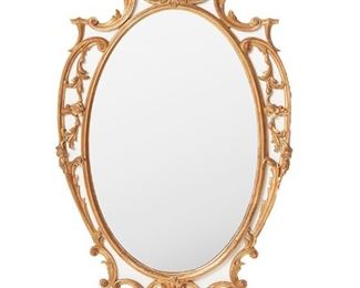 1120
An Italian Carved Giltwood Wall Mirror
Second-Quarter 20th Century
The carved giltwood frame with scrolled floral motifs enclosing an oval glass mirror
51" H x 29" W x 2" D
Estimate: $500 - $700