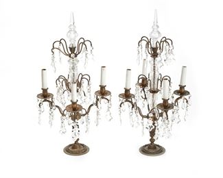 1127
A Pair Of Gilt-Bronze Girandoles
First-Quarter 20th Century
Each girandole suspending clear glass drops and issuing four scrolled arms with faux-candle sleeves, electrified, 2 pieces
Each: 25.75" H x 13.25" Dia.
Estimate: $500 - $700
