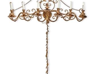 1128
A Large Italian Gilt-Bronze Wall Sconce
20th Century
The large, seven-light sconce with scrolled frame and faux-candle sleeve light sockets, electrified
58" H x 41" W x 7" D
Estimate: $200 - $300
