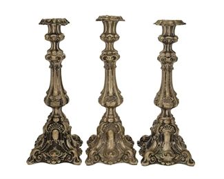 1136
Three Continental Silver Candlesticks
19th Century
Appear unmarked
Each hollow silver candlestick with matching repousse rocaille motifs, 3 pieces
Each: 15.5" H x 6" W x 6" D approximately
33.83 oz. troy approximately
Estimate: $600 - $800