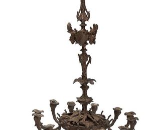 1139
An Armorial-Style Bronze Chandelier
19th Century
The twelve-candle chandelier with armorial motif arms and armor issuing figural dolphin arms
35" H x 20.5" Dia.
Estimate: $500 - $700