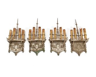 1140
Four Silvered-Bronze Wall Scones
First-Quarter 20th Century
Each four-light sconce with armorial-style decoration and faux-candle sleeves, electrified, 4 pieces
Each: 17" H x 8" W x 3" D
Estimate: $600 - $800