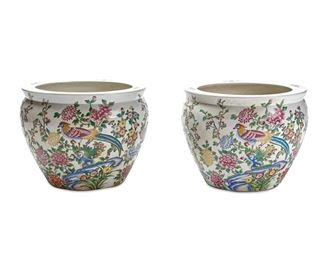 1152
A Pair Of Chinese Porcelain Fish Bowls
20th Century
Each marked with Chinese characters to underside
Each large fish bowl or jardiniere planter in white glazed porcelain with polychrome painted avian and floral motifs, 2 pieces
16" H x 20.25" Dia.
Estimate: $500 - $700
