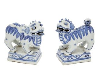 1155
A Pair Of Chinese Porcelain Guardian Lions
20th Century
Each glazed blue and white porcelain raised on rectangular bases, 2 pieces
Larger: 8.5" H x 4.5" W x 7" D; Smaller: 8.25" H x 4.25" W x 7.5" D
Estimate: $200 - $300