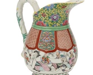 1154
A Chinese Famille Rose Porcelain Pitcher
20th Century
Marked with red overglaze Chinese characters
The famille rose porcelain pitcher with a figural scenes, floral motifs, and a bamboo-style handle
9.125" H x 8.5" W x 5.5" D
Estimate: $200 - $300