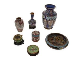 1158
A Group Of Chinese Cloisonné Table Items
One dish marked: China; Low bowl with pseudo Xuande mark
Each enamel cloisonné with floral and dragon motifs, comprising a large baluster-form vase, a small urn-form vase, a small tall neck vase on wood stand, a low bowl, a lidded canister, an incense burner on wood stand, and six small dishes, 12 pieces
Larger: 10" H x 5.5" Dia.; Smaller: 0.5" H x 3.625" Dia.
Estimate: $600 - $800