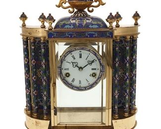1157
A Chinese Cloisonné Mantle Clock
Second Half 20th Century
Marked: Made in the Peope's Republic of China / No. 19
The mantel clock with white enamel dial, black Roman numeral hour markers, black Arabic numeral minute markers and outer minute track, and two train movement set in a glazed, polished brass case with cloisonné accents
19.5" H x 13.625" W x 5.75" D
Estimate: $300 - $500