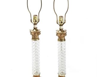 1171
A Pair Of Glass And Gilt-Metal Table Lamp Bases
20th Century
Each single-light, architectural-stye lamp with cast glass column and gilt-metal accents, electrified, 2 pieces
Each: 34" H x 5.75" W x 5.75" D
Estimate: $200 - $300