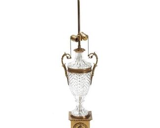 1172
A Cut Glass Table Lamp Base
20th Century
The two-light, cut glass lamp with urn-form body and brass mounts, electrified
41" H x 9" W x 7" D
Estimate: $200 - $300