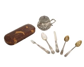 1177
A Group Of English Sterling Silver Holloware And Flatware
19th Century
Comprising a matching pair of gold wash George III repousse berry spoons (each: 5.25"), a George IV repousse lidded mustard pot (3.5" H x 4.25" W x 3.25" D), and a Victorian three-piece flatware set in a wood case (case: 1" H x 7.25" W x 3.25" D), 7 pieces
Weighable sterling: 6.45 oz. troy approximately
Estimate: $400 - $600