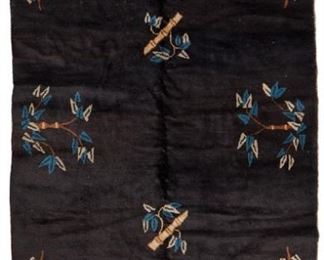 1196
A Chinese Pictorial Rug
Circa 1920s-30s
Possibly Mongolian, llama wool on cotton woven with blue and cream bamboo motifs with cottage corner decorations on a black field
80.25" L x 48.5" W
Estimate: $400 - $600