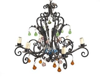 1201
A Crystal And Wrought Iron Chandelier
20th Century
The black wrought iron chandelier with a scrolled cage frame issuing six arms terminating in faux-candle sleeve light sockets, decorated with colored glass fruit drops, electrified
25" H x 29" Dia.
Estimate: $400 - $600
