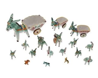 1207
A Group Of Italian Provincial Pottery Figures
Mid-20th Century
Largest cart figure signed: Dimauro / Vietri
Each polychrome painted and glazed earthenware, comprising three donkies pulling carts, two small donkies with vessels, six miniature donkies, four miniature elephants, and a miniature giraffe and boar, 17 pieces
Larger: 6.75" H x 10.75" W x 5" D; Smaller: 1.25" H x 1.75" W x 1" D
Estimate: $300 - $500