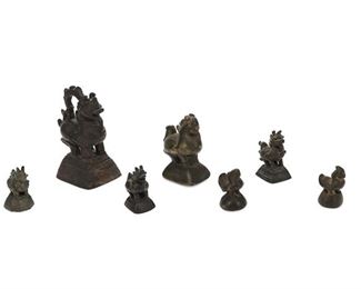 1250
A Group Of Thai And Burmese Bronze Opium Weights
Circa 18th/19th Century
Comprising seven patinated bronze, figural opium weights, 7 pieces
Larger: 4.75" H x 3.5" W x 2.5" D; Smaller: 1.875" H x 1.25" W x 1.25" D
Estimate: $300 - $500