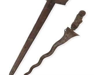 1251
A Javanese Short "Kris" Dagger
20th Century
The asymmetrical dagger with a carved wood scabbard and figural handle
In scabbard: 18.5" L x 5.5" W x 2" D
Estimate: $500 - $700