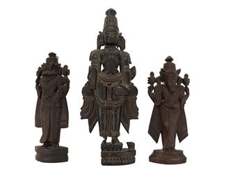 1254
A South Indian Carved Wood Figure Of Vishnu And Two Avatars
20th Century or earlier
Depicting Vishnu and his avatars Varaha and Narasimha, 3 pieces
Larger: 11.75" H x 4.25" W x 1.75" D; Smaller: 7.875" H x 3.5" W x 1.5" D
Estimate: $300 - $500