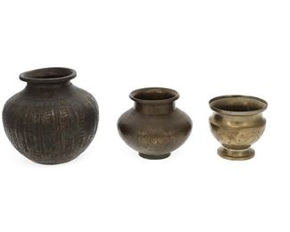 1256
Three Indian Brass "Lota" Vessels
First-Quarter 20th Century or later
Each vessel with chased designs, 3 pieces
Larger: 6.5" H x 6.25" Dia.; Smaller: 3.875" H x 4.125" Dia.
Estimate: $100 - $200