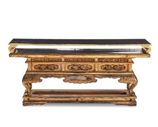 1258
A Japanese Lacquered Wood Stand
Meiji Period (1868-1912)
With gilt highlights and carved wood decoration, comprising the footed stand with additional tier, 2 pieces
Overall: 9.875" H x 21.75" W x 5.375" D
Estimate: $200 - $300