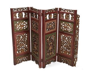 1263
A Chinese Carved Wood Folding Screen
First Half 20th Century
The four panel screen with polychrome and gilt floral motifs
38" H x 57" W x 1.75" D
Estimate: $200 - $400