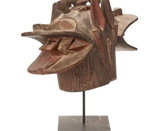 1274
An African Senufo Janus Firespitter Helmet Mask
20th Century
The carved wood zoomorphic mask with polychromed details
14.5" H x 8.5" W x 22" D
Estimate: $600 - $800