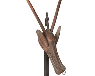 1275
An African Bambara Antelope Mask
20th Century
The carved wood zoomorphic mask depicting an antelope with long horns and a central figure
40" H x 23" W x 13.5" D
Estimate: $500 - $700