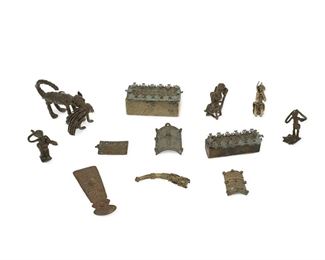 1278
A Group Of African Brass Items
20th Century; Akan people, Ghana
Each variously designed, comprising two lidded boxes, five figural miniatures, a spoon, and four miscellaneous items, 12 pieces
Larger: 2.125" H x 3.75" W x 2.25" D; Smaller: 1.5" H x 1.25" W x 1" D
Estimate: $300 - $500