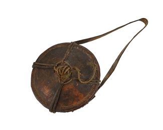 1285
A Somalian Food Carrier
20th Century
The woven food carrier covered in leather with shoulder strap
With shoulder strap: 16.875" H x 7.75" W x 5.25" D
Estimate: $100 - $200