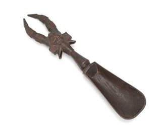 1287
A Nigerian Ritual Spoon
Late 19th/Early 20th Century; Igala people, Southeast Nigeria
Ritual wood spoon with horned mask handle
20.5" H x 4" W x 2" D
Estimate: $50 - $100
