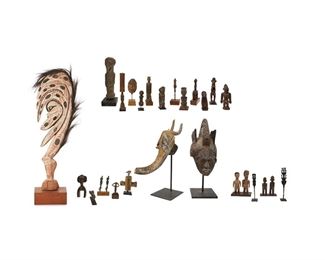 1288
A Large Group Of African And Oceanic Figures
20th Century
Comprising a variety of carved wood and metal figures, some with beaded, hide, and hair elements, 24 pieces
Larger: 41.25" H x 12" W x 2.75" D approximately; Smaller: 6.25" H x 2.75" W x 1.5" D
Estimate: $500 - $1,000