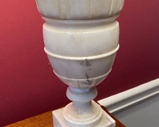 Close up of antique carved marble base lamp