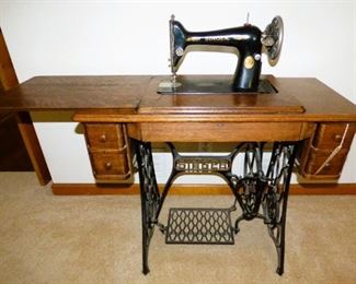 Antique Singer Sewing Machine in Oak Cabinet