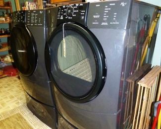 Kenmore front loading washer/dryer set with storage drawers