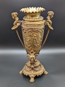 Ornate Brass Vintage Urn with Figural Handles, Masks and engraved figurines. Features a unique and gorgeous  raised relief design