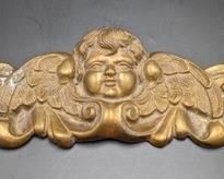 Vintage Brass Cherub Wall Hanging. There is some wear/oxidization that can be seen in the photos. Measures 10” wide and 4.5” high.