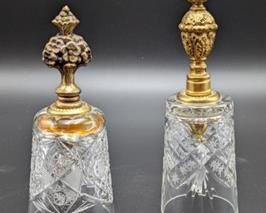 Pair of Vintage Etched Crystal Bells with ornate handles.

There is some wear on the gold tone handles and discoloration on the adhesive that can be seen in the photos. The tallest measures 6.5” high. 