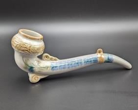Vintage Painted Porcelain Pipe. There is some adhesive residue on the bottom that can easily be removed. Measures 8.5” long and 3.5” high.