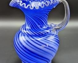 Vintage Blue and White Swirled Art Glass Pitcher. Measures 9” high and 7” in diameter at the top.