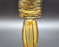 mber Art Glass Candleholder. Measures 8.25” high and 2.5” in diameter at the top.