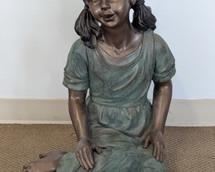 Vintage Painted Child Sculpture. Feels to be made of plaster. Measures 25” high and 14” wide