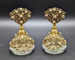 Pair of Vintage Gold Tone Filigree Perfume Bottles. Stunning bejeweled set of vintage perfume bottles! Each measures 5.25” high and 3” wide.